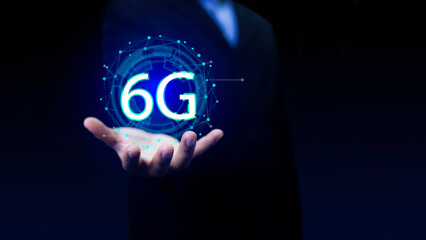 6G Technology networks Internet connecting wireless devices around the world. 6g icon in businessman hand. 6G technology is essential to businesses in the digital world..
