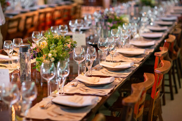 Floral Centerpiece with Hanging Glass Candles at Event