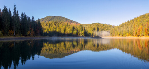 autumn landscape with lake in morning light. beautiful travel destination of europe in carpathian mountains of ukraine