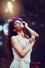 Naklejka premium Garden, thinking or woman with flowers in crown with creative style or classy outfit for confidence. Floral design, nature or girl with elegant dress in fantasy cosplay for fashion or costume ideas