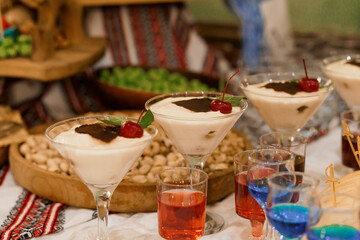 Festive Dessert Table with Cherry Topped Creamy Treats