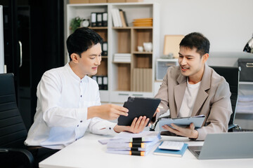 Obraz premium Team work process. Photo young business crew working with new startup project. Project managers meeting. Analyze plans, papers.