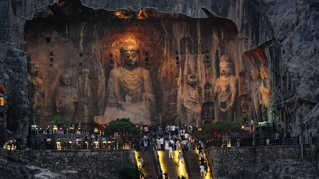 Luoyang, China: Night view of the famous Vairocana Buddha statue that lies in the Luoyang Longmen Grottoes complex in China. The statues dates from the 7th century.