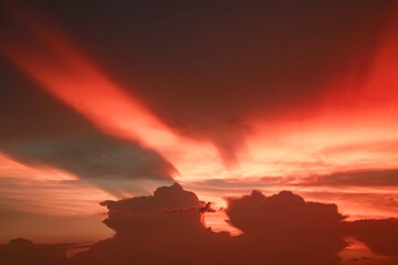 Dramatic sunset sky with clouds.