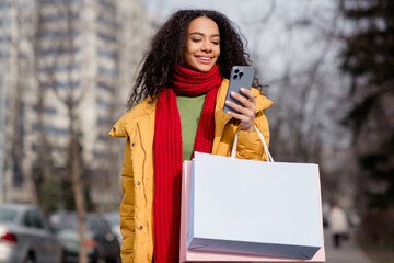 Photo of cute pretty girl wear stylish jacket hold phone walk downtown boutique store mall center...