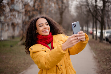 Photo of adorable attractive girl wear stylish jacket walk downtown city center weekend trip autumn...