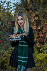 Woman holding in hands spooky Halloween cookies witch fingers. Holidays mystical details for party