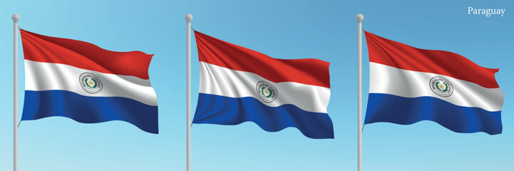 Set of three flags of Paraguay waving on flagpoles