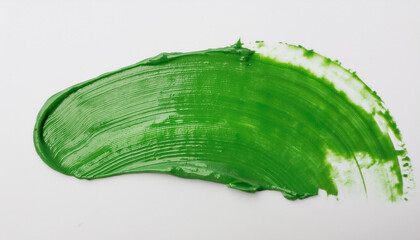 Green oil paint smudge on white background.