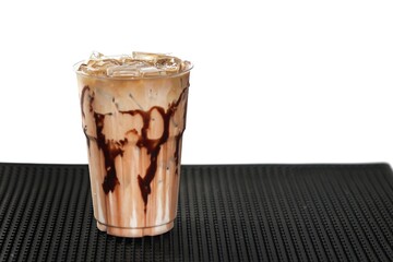 Mocha ice coffee put on bar mat,ready for drink.serving with chocolate sauce topping.
