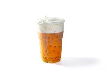 Thai tea ice serving with foam milk topping in white background and isolated style.