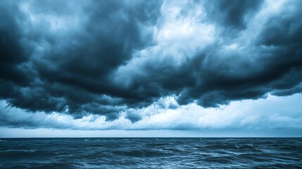 Dark storm clouds gather over a turbulent ocean, creating a dramatic seascape.