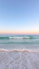 Peaceful ocean waves at sunset under a pastel sky, ideal for backgrounds or serene travel themes
