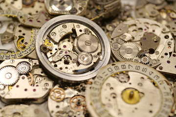 Old mechanical watches with gears and cogs. Watch or clock mechanisms