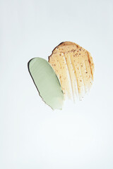 Different swatches of cosmetic products for the face and body. Scrub textures. Selfcare trend. Vertical