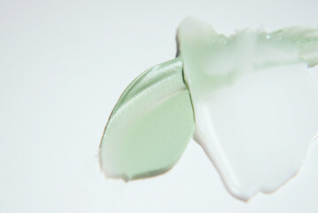 Close-up of smears of cosmetics for the skin on a white background. Texture of skin care cosmetic product. Selfcare trend. Copy space