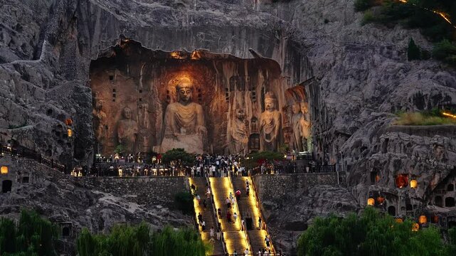 Luoyang, China: Night view of the famous Vairocana Buddha statue in the Luoyang Longmen Grottoes in China. The statues dates from the 7th century.