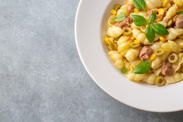 Italian Tuna conchiglie pasta with green beans, olives and red onion. Healthy diet food
