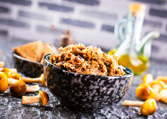 Mushroom pate in a bowl with toast