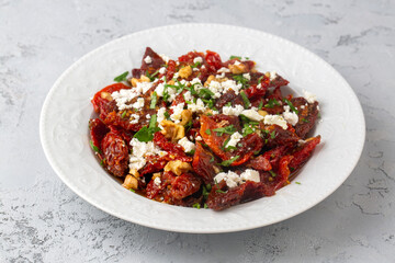 Traditional, delicious Turkish appetizers; Dried tomato appetizer salad with walnuts (Turkish name; Kurutulmus domates mezesi salatasi)