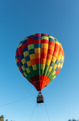 Colorful Muticolor hot air balloon floting in the blue sky.