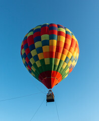 Fototapeta premium Colorful Muticolor hot air balloon floting in the blue sky.