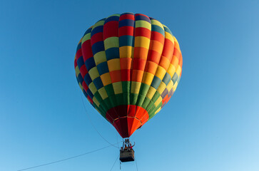 Fototapeta premium Colorful Muticolor hot air balloon floting in the blue sky.
