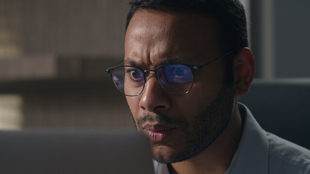 Indian shocked stressed amazed bad wonder businessman shock Arabian man American confused worker employer looking with big eyes in laptop computer screen afraid scare negative office business failure