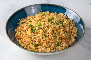 Traditional delicious Turkish food, bulgur pilaf with vermicelli (Turkish name; arpa sehriyeli bulgur pilavi)