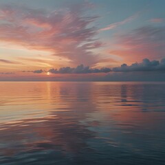 Obraz premium Pastel Sunset over Calm Ocean with Soft Clouds