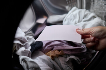Laundry Process Illustrated with a Hand Gripping a Blank Sheet in the Background