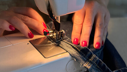 Modern sewing machine presser foot with linen fabric and thread, closeup, copy space. Sewing process clothes, curtains, upholstery. Business, hobby, handmade, zero waste, recycling, repair concept