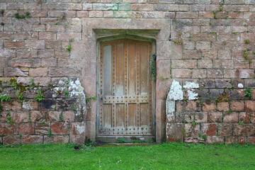 Medieval building and old wooden door in England, UK