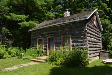A log blacksmith's house built in the early 19th century in Canada.