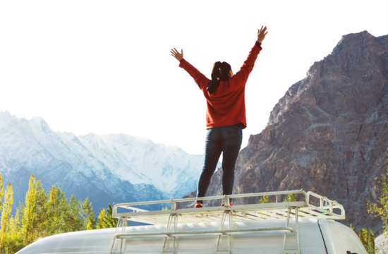 PNG Woman standing on a van facing the beautiful mountain collage element, transparent background