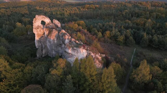 Sunset over Okiennik Wielki limestone boulders Jurassic Highland In Silesia Poland
