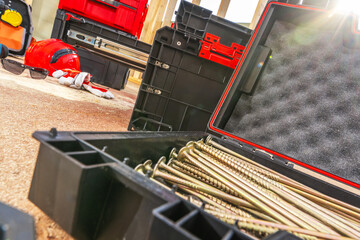 Tools and Hardware Lay Scattered in a Workshop During an Afternoon Renovation Project