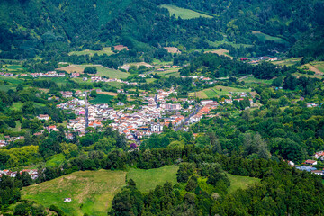 A close up view from the crater rim towards the town of at Furnas on the island of San Miguel in the Azores in summertime