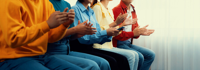 Group of startup company employee gather in line at corporate event to applaud achievement and celebrate company's success or business presentation meeting with audience in panorama banner. Synergic