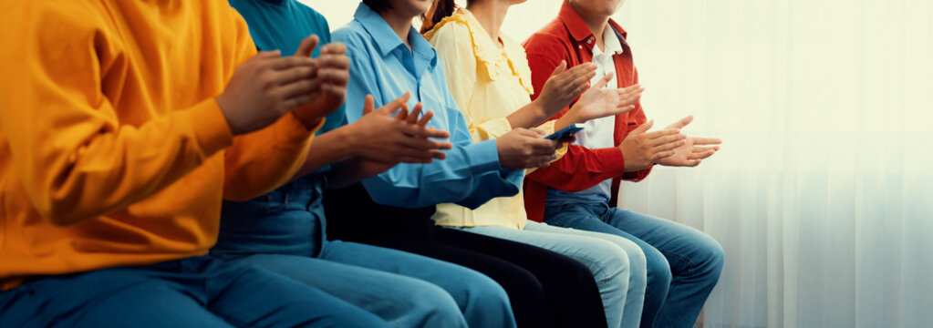 Group of startup company employee gather in line at corporate event to applaud achievement and celebrate company's success or business presentation meeting with audience in panorama banner. Synergic