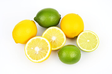 Bunch of lemons and limes are on a white background.