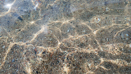 Much stones in the sea, river, lake, ocean water. Nature background.