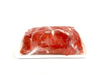 Pack of frozen fresh and raw red beef sirloin slice in plastic wrap isolated on white background
