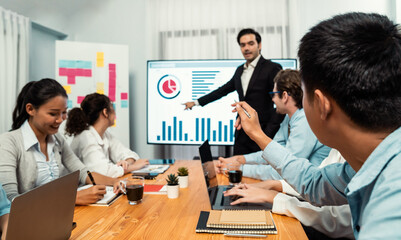 Businessman deliver business presentation with financial report data analysis or market trend show on big TV screen for strategic planing in meeting room for company future direction. Habiliment