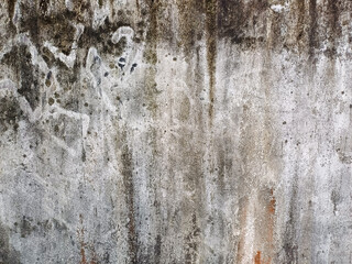 Obraz premium Old Grey Stucco Concrete Wall Seamless Background Texture: Detailed Close-Up for Versatile Background Usage, Showcasing a Weathered Surface with Cracks and Rough Patterns for a Rustic Aesthetic