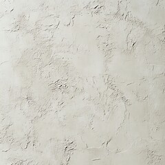Fototapeta premium Textured plaster wall surface with rough, natural patterns and subtle color variations.