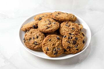 chocolate chip cookies on a white plate