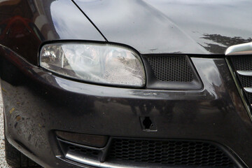 A detail of the older car´s headlight with the dew on the glass inside. Caused by some leakage which allows the water to get inside. Needs to be fixed or changed. 