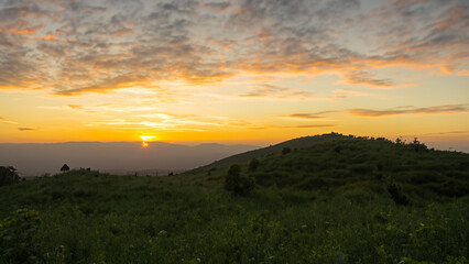 Obraz premium Sunsets in the hill background.
