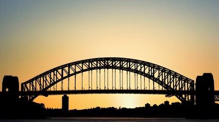 Fototapeta premium Silhouetted Sydney Harbour Bridge at Dramatic Sunset with Blank Sky for Copy Space
